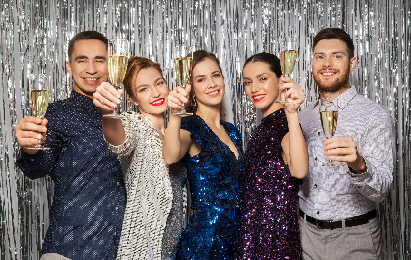 Happy Friends Toasting Champagne Glasses at Party